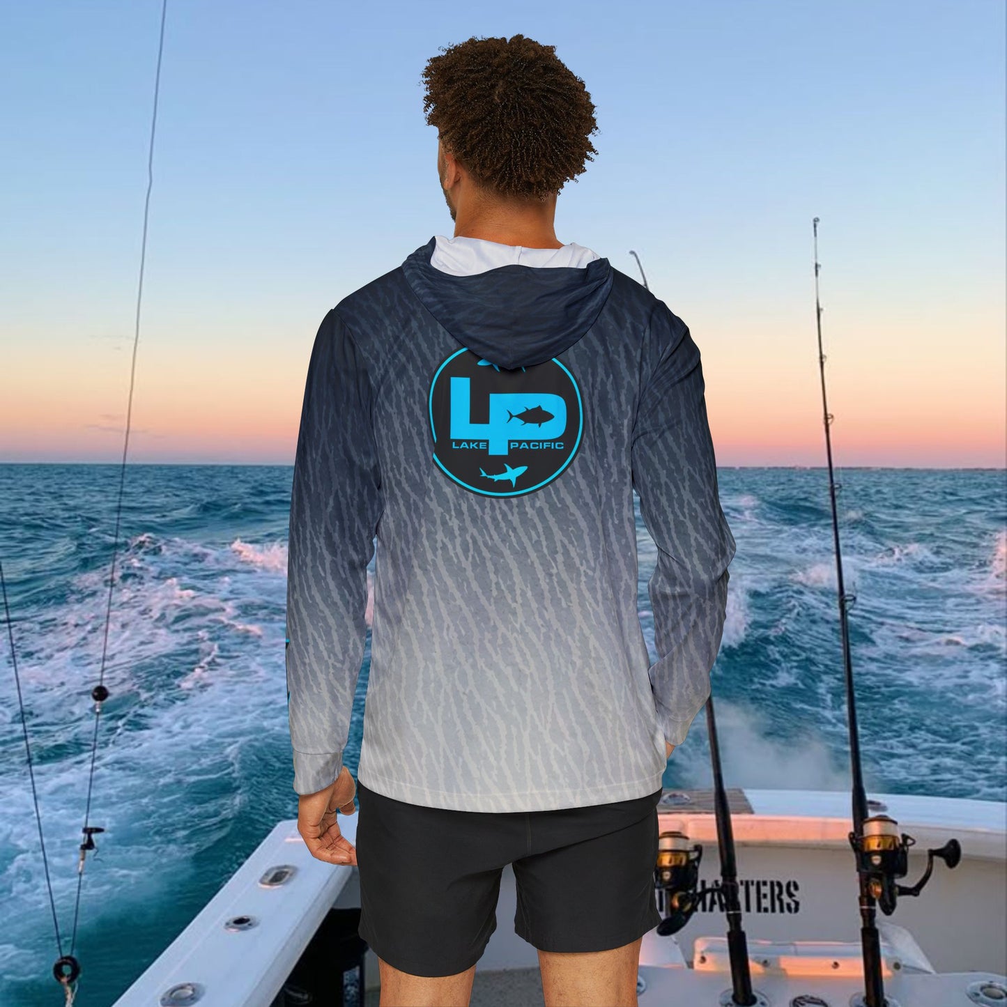 Angler wearing Lake Pacific Tiger Shark performance fishing hoodie on the water
