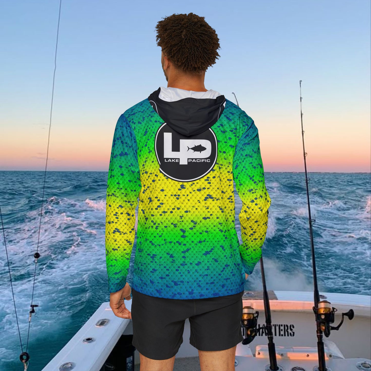 Angler wearing Lake Pacific Dorado performance fishing hoodie offshore