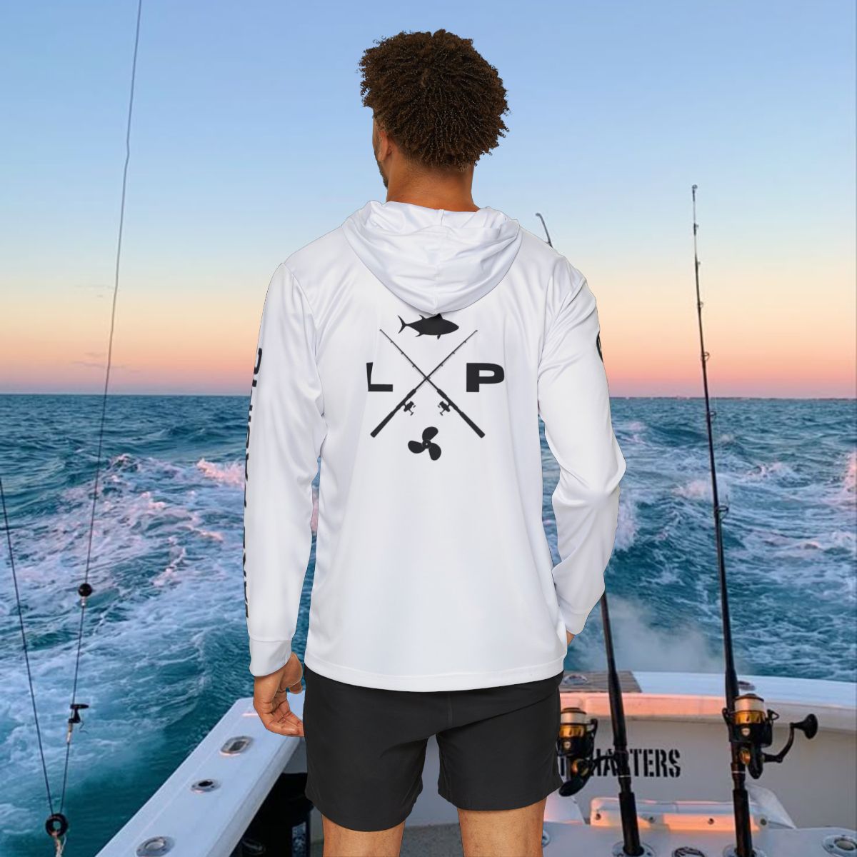 Angler wearing Lake Pacific Crossed Rods performance fishing hoodie on the water