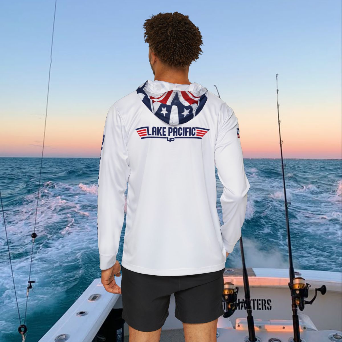 Angler wearing Lake Pacific Top Gun performance fishing hoodie on the water