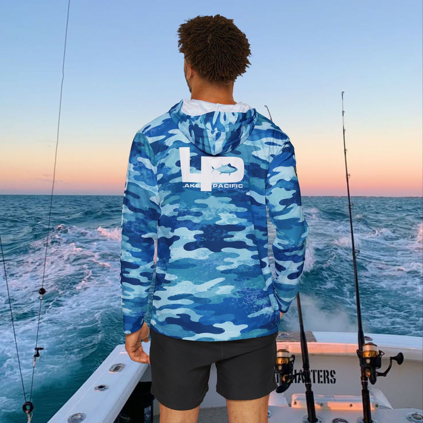 Angler wearing Lake Pacific Blue Camo performance fishing hoodie on the water