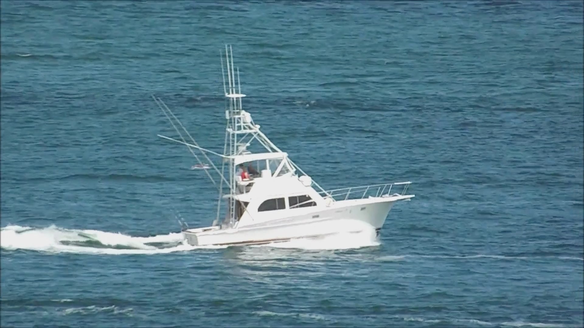 Load video: Sportfishing boat cruising offshore on the Pacific Ocean, representing the Lake Pacific fishing and coastal lifestyle.